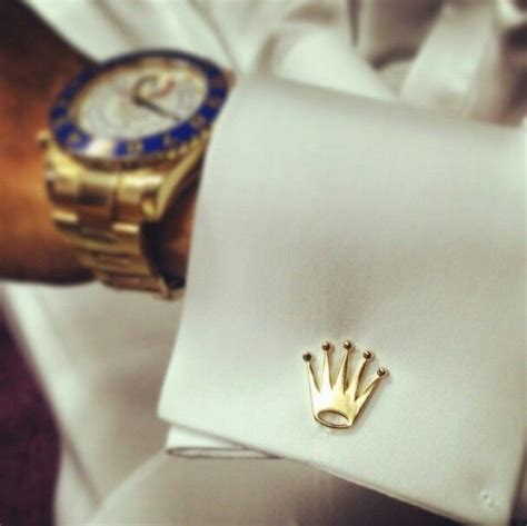 rolex logo cufflinks.